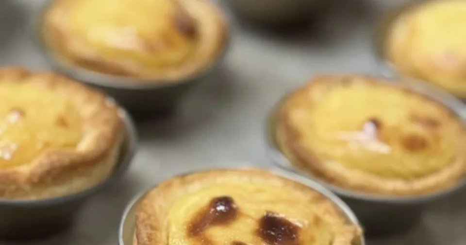 Close view of several custard tarts in a row